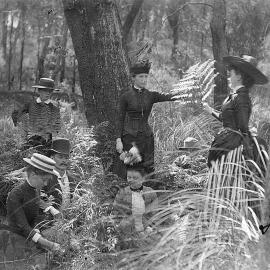 Group photo, men, women and children in bush setting