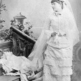 Full-length portrait photo of woman in wedding dress