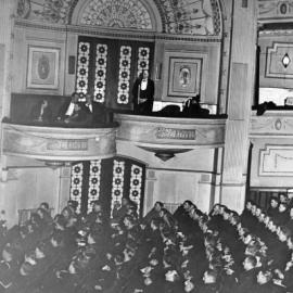 Archibald Crofts addressing armed forces servicemen during "Crofts Radio Revels" at the Princess Theatre,  Melbourne, Victoria.