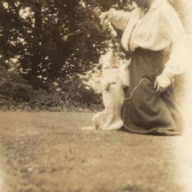 Woman playing with dog