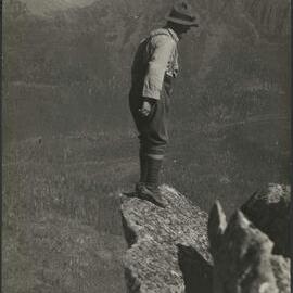 "A Peep into Eternity" A projecting rock overhanging a drop appro x imately 2000 feet on Mount Pelion local in Tasmanian central highlands