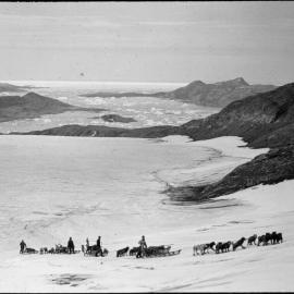 Sledges ascending 'Bug-bear bank', Base Fjord in background