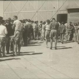 Students milling outside corrogated iron classroom at Mildura branch, University of Melbourne, 1947-1949.