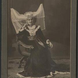 Photograph of model wearing reproduction 19th century costume