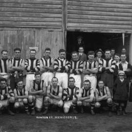 A  Winton Football Club premiership team posed in front of a timber pavilion in 1929.