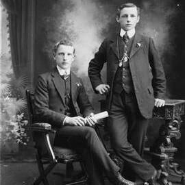 Studio portrait of two well dressed young men.
