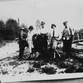 An unidentified group of three women and two men in bushland.