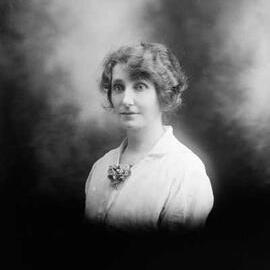 Studio half-length portrait of a woman.