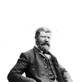 Portrait of an unidentified a man with a full moustache and beard.