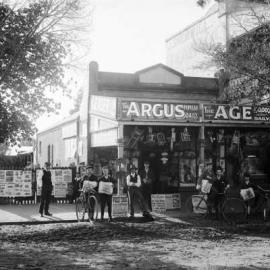 Newspaper sellers outside the shop of Mrs. J.R. Clark, Newsagent and Stationer in Benalla.
