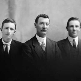 Studio portrait of three men.