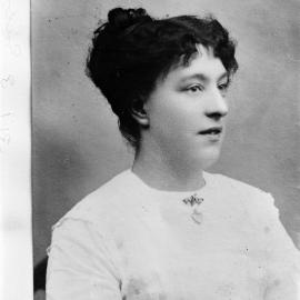 An unidentified young woman wearing a heart locket.