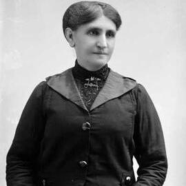 Studio half-length portrait of a woman.