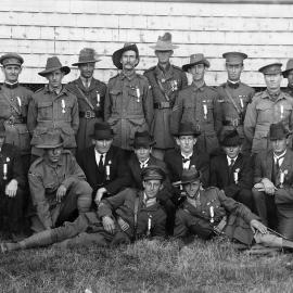 A group of men, some wearing Australian Army uniforms.