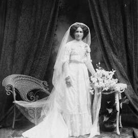 Studio portrait of  Mrs. Jennings dressed as a bride.