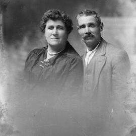 Studio portrait of an unidentified woman and man.