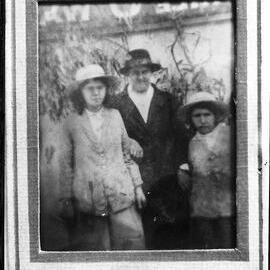 An unidentified group of three females in an outdoor setting.