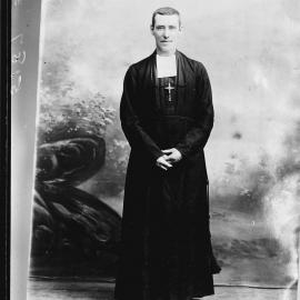 Studio portrait of a robed clergyman.