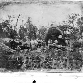 A farming scene showing men and horses at work.