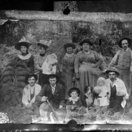 An unidentified group of people in a forest environment.