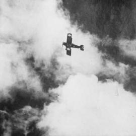 An R.A.A.F. bi-plane aircraft in flight.