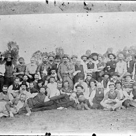 A large group of men in an outdoor setting.