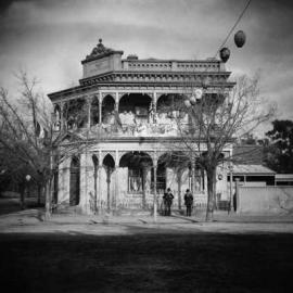 The Bank of New South Wales building in Benalla, with decorations and street lanterns displayed to celebrate the coronation of King George 5th.