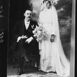 Studio portrait of an unidentified wedding couple.
