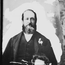 An unidentified man dressed in a suit.