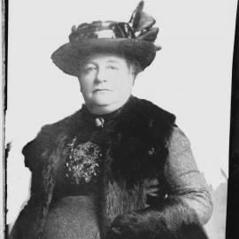 An unidentified woman wearing a large fur stole.