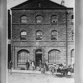 A three-storied warehouse building with an attic.