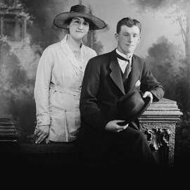 Studio portrait of a young man and woman.  Family name Gravenerall.