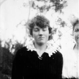 A half-length view of a young woman.