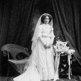 Studio portrait of Mrs. Jennings dressed as a bride.