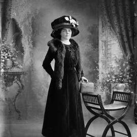 Studio portrait of Miss or Mrs. Hartley dressed in black.
