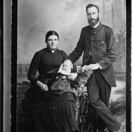 Studio portrait of a man,  woman and a  baby.