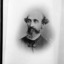 Portrait of an unidentified balding and bearded man.