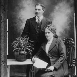 Studio portrait of a woman and a man.