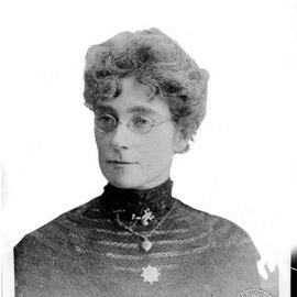 Portrait of an unidentified woman wearing a frog brooch.