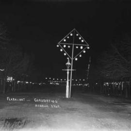 A street in central Benalla displaying lanterns and other illumination to celebrate the coronation of King George 5th.