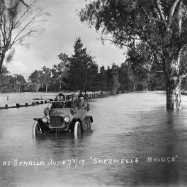 A car in the middle of flooded countryside at Sherwell's Bridge near Benalla, on 7th June 1917.