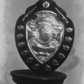An engraved military challenge shield.