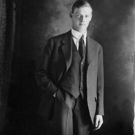 Studio portrait of Mr. Rudd wearing a three-piece suit.