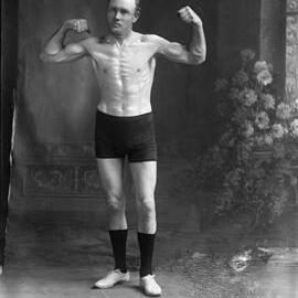 An unidentified man demonstrating a callisthenic pose.
