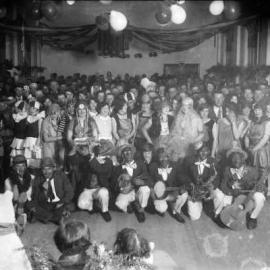 A fancy dress group with minstrels at an unknown function, possibly in Benalla.
