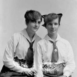 Studio portrait of two young women.  Family name Scully.