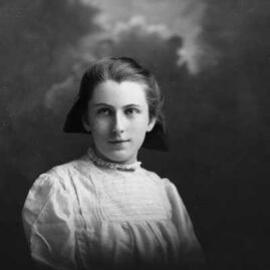 Studio portrait of a young woman in a white blouse.  Family name Bird.