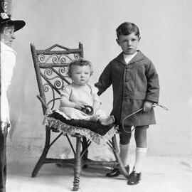 Studio portrait of two young children.  Family name Fowler.