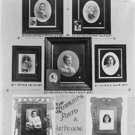 An advertising display board labeled ‘Howship Photo and Art Framing Studios’.