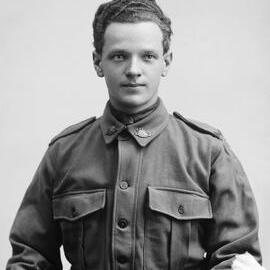Studio portrait of a young man wearing an Australian Army uniform.